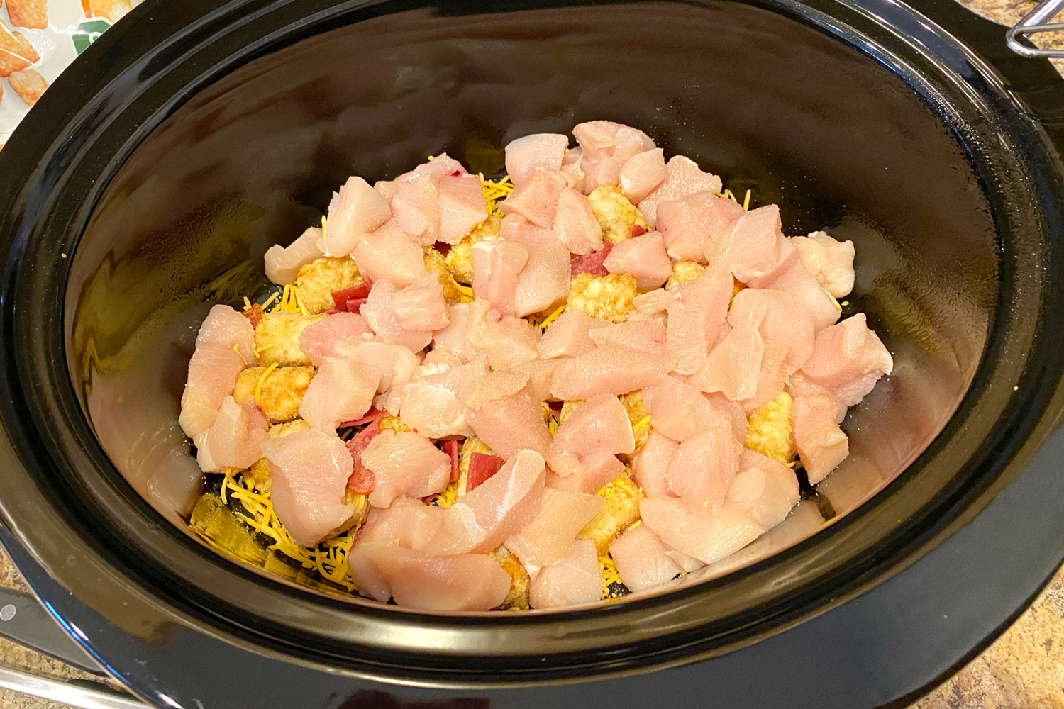 First layer of tater tots and chicken