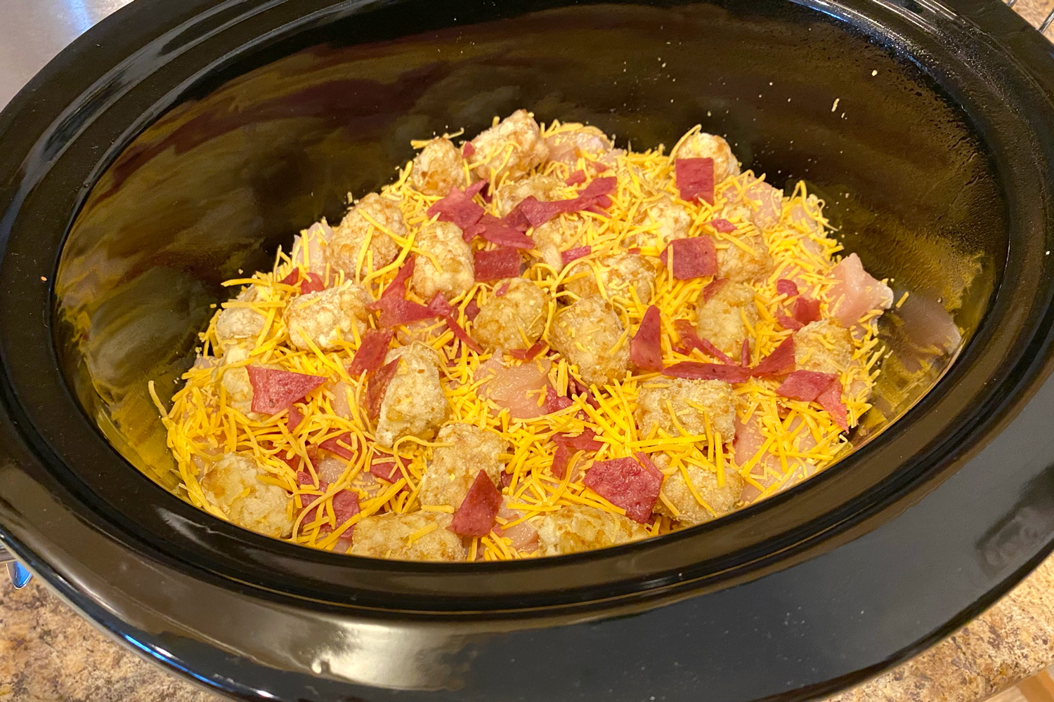 layer more cheese, bacon, and tater tots
