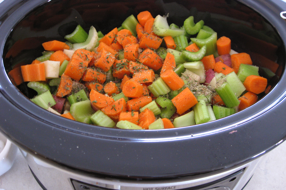 veggies and herbs in slow cooker