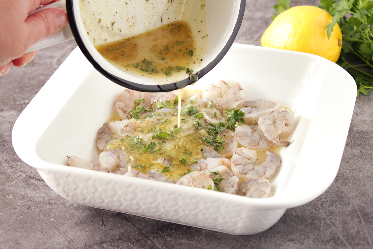 pouring sauce over shrimp