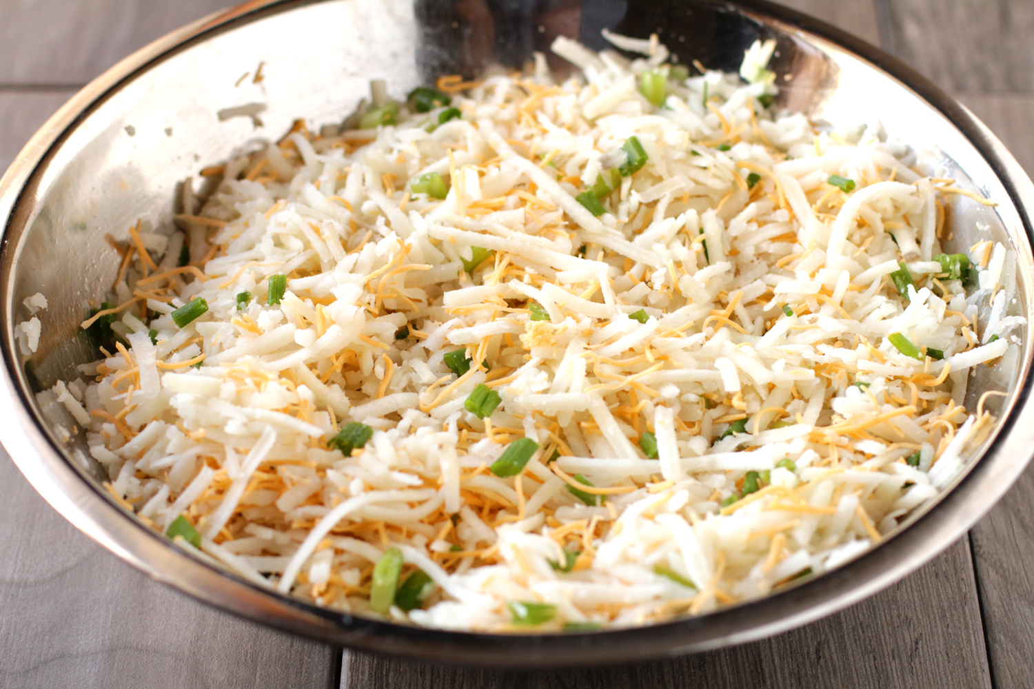 making cheesy hashbrown casserole