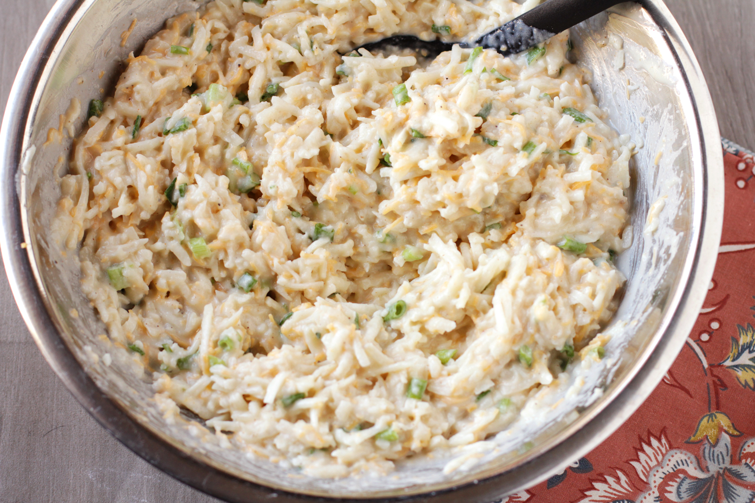 making cheesy hashbrown casserole