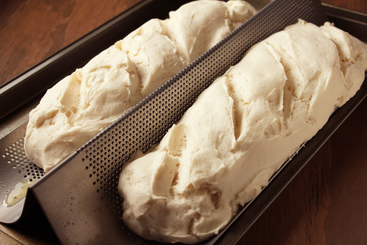 gluten-free french bread dough rising in the pan.