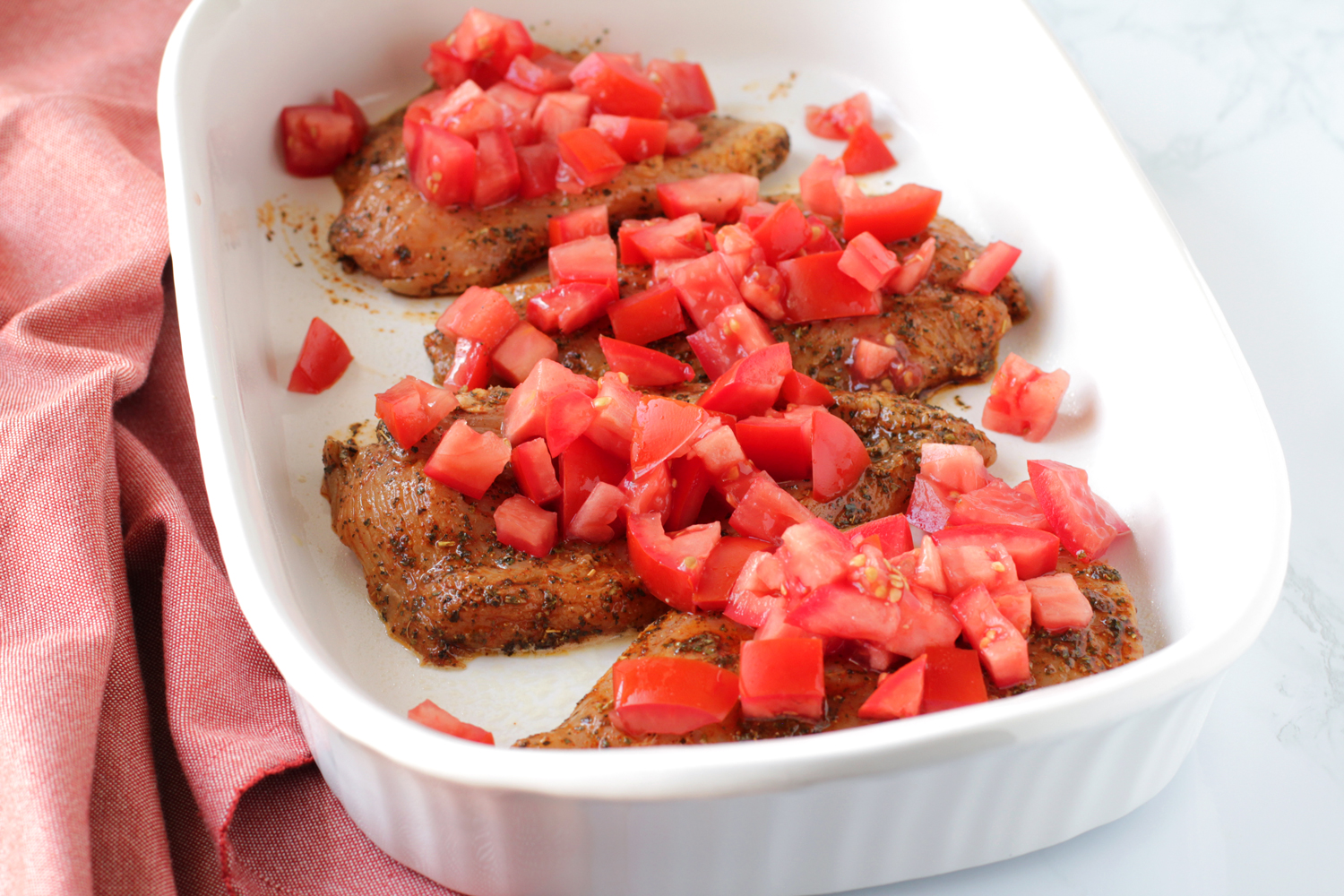 top chicken with tomatoes
